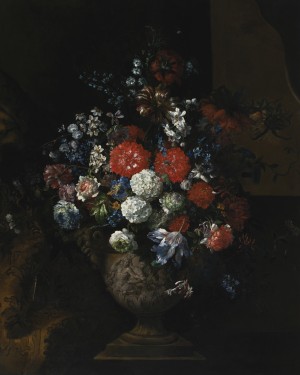 Still life of flowers, including tulips, roses, poppies and viburnum in a sculpted urn,resting on a stone plinth